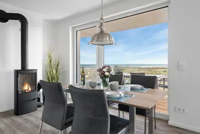 Image de \"BeachLoungeOne\" vacation apartment on the beach with sun terrace, sauna & sea view