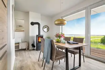 Image de \"BeachLoungeThree\" vacation apartment on the beach with sun terrace, sauna & sea view