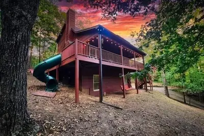 Image de Family Cabin Fun: Deck Slide, Hot Tub, Fire Pit & Resort Amenities!