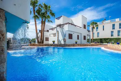 Image de Appartement La Perla de Cala d'Or 8 avec piscine partagée, jardin et Wi-Fi