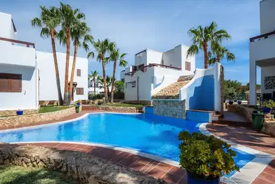 Image de Appartement La Perla de Cala d'Or 10 avec piscine partagée, jardin et Wi-Fi