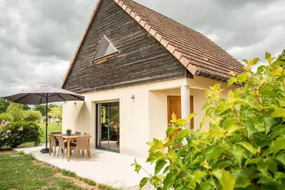 Image de Maison dans un parc de vacances avec piscine