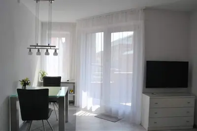 Modern 2-room vacation apartment in the city center with balcony