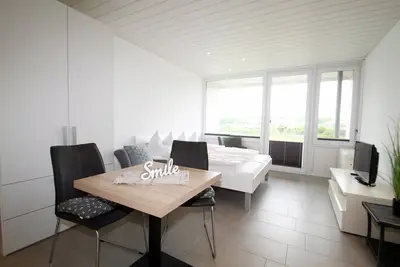 Really cozy vacation apartment with sunny south-facing balcony and water view to the B