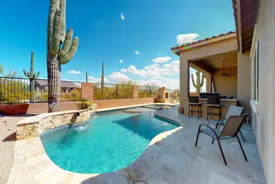 Image de Southwestern stunner with enclosed yard, pool, putting green, & grill