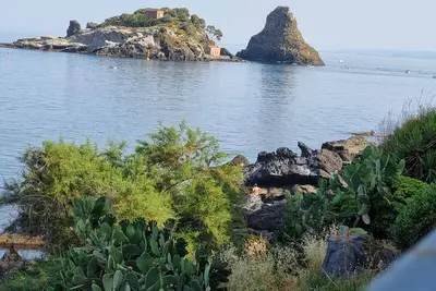 Charming sea-front Bivani Aci Trezza two meters from the sea, on the cliff.