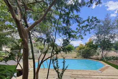 Image de Bel appartement climatisé avec jardin et piscine