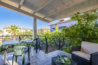 Image de Maison de vacances Appartamento LaTorre avec balcon, terrasse et jardin partagé