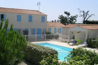 Image de Maison 4 personnes dans petite résidence avec piscine