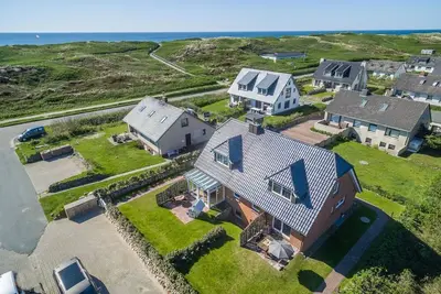 Image de Am Sandwall-westseite - Strandnahe Doppelhaushälfte für 4 Personen: Terrasse, Garten, Stellplatz,