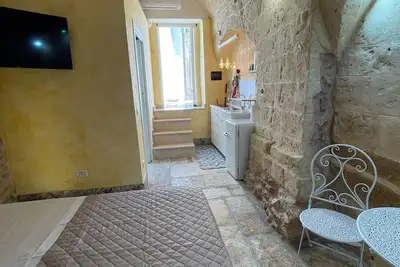 Image de Caratteristica sistemazione nel cuore del centro storico.