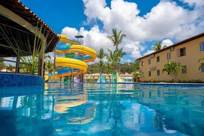 Image de Suite in a hotel on the Porto Seguro waterfront with a water park and leisure facilities for the family.