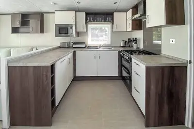 Image de A cosy holiday home with one master double and two twin rooms.