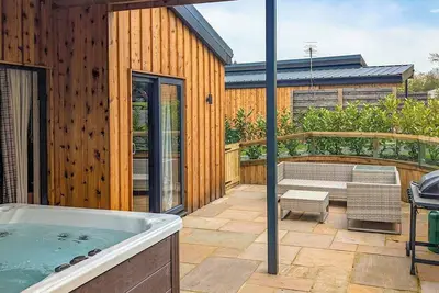 Image de A magnificent bespoke lodge perfect for a family escape with pets.