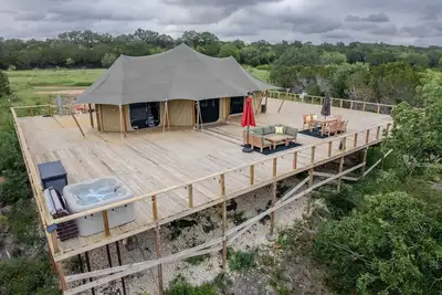 Private Outdoor Hot Tub with Stunning Mountain View Safari Tent Suite Glamping