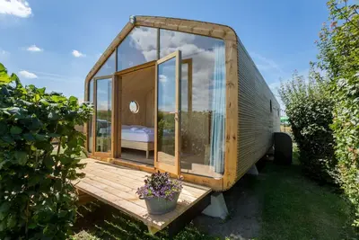 Image de Petite maison enveloppante au bord de la plage