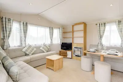 Image de Superior 12ft-wide caravan with two twin with four singles.