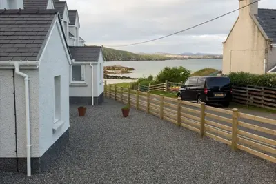 Taigh Tharmoid Ruaidh, pet friendly, with open fire in Timsgearraidh