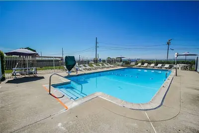 Hot tub on your deck and beach across the street. . . Relax