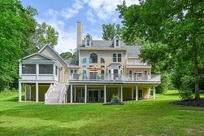 Image de Lakefront home with private beach, dock, deck, kayaks, game room, & fireplace