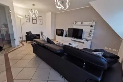 Image de The modern Welness apartment is located in Bad Essen with a view of the Wiehengebirge mountains.