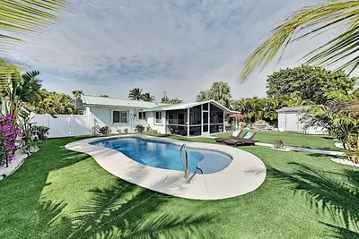 Quiet, spacious canal-side home with private pool, waterfront patio & central Ac