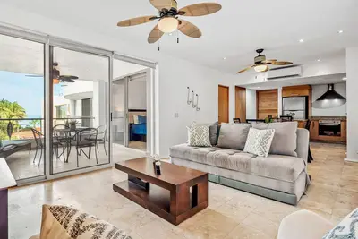 Ocean-view condo with pools, roof deck, lounge, private balcony, & Ac