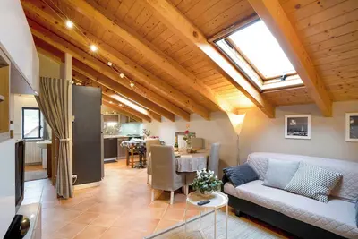 Image de Appartement 'Mansarda Margherita' avec vue sur les montagnes & Wi-Fi