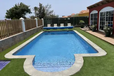 Luxury air conditioned Villa with large gardens private heated pool free WiFi.