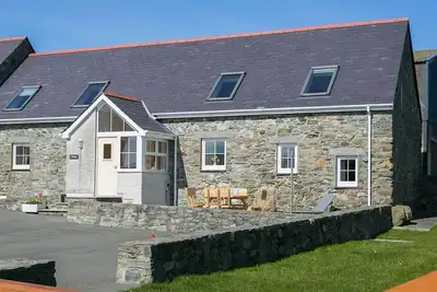 Image de Beudy Penrhyn - an on the beach that sleeps 8 guests in 4 bedrooms
