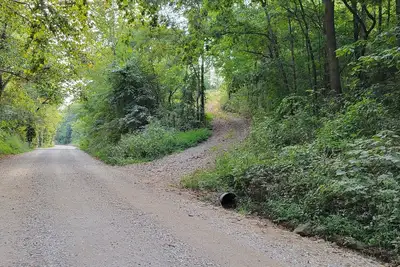 Image de Cozy cabin 16 miles from Razorback Stadium great for game weekends. No pets.