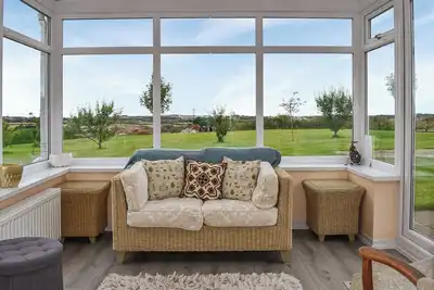 Image de Set within peaceful countryside with lovely gardens and views across to the sea.