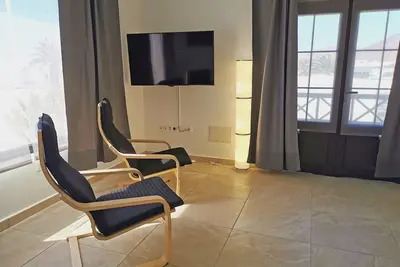 Appartement d’une chambre lit double, balcon et vue sur la mer dans le Tahiche.