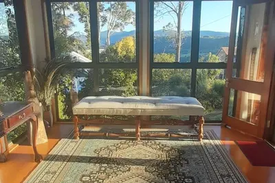 Image de Bluehaven stunning mountain views set in treetop canopy.