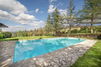 Image de Appartement 'Magnolia Antico Casale '700' avec piscine partagée et Wi-Fi