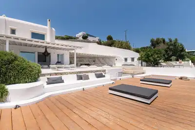 Image de Enjoy indoor luxury and alfresco above pristine Psarou Beach