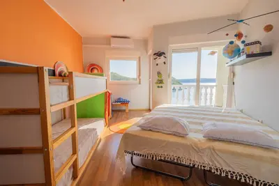 Big apartment with a balcony right next to the sea