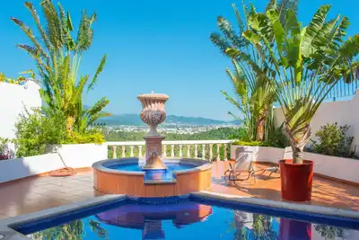Ocean, mountain, valley, & golf course views. Walk to the beach.