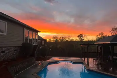 Image de Masters Week suburban stunner, pool, sauna and outdoor pergola with fireplace.