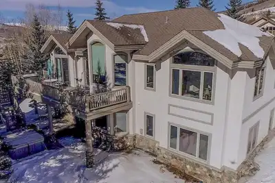 Splendid abode with awe-inspiring views, a hot tub, and a pool table ready!
