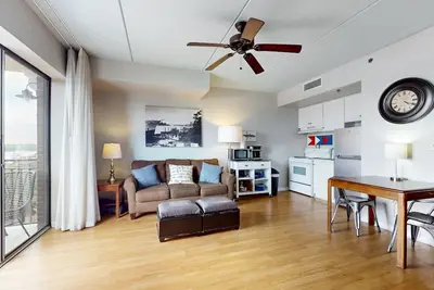 2 historic district condos with river-view balconies & highly walkable locale