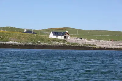 Image de Shore Cottage -The sea and the sky become one in this gem of a cottage.