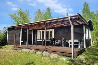 Image de Cozy vacation home with fireplace, close to lake and sea and with rowing boat