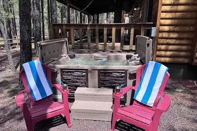 Tranquil forest cabin with private hot tub, firepit, play area, enclosed yard