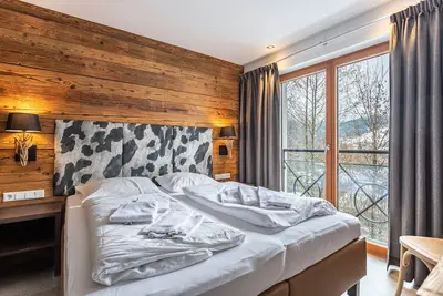Image de Appartement de vacances \"Mountain Lodge Leogang - Top4\" avec vue sur les montagnes, balcon et Wi-Fi.