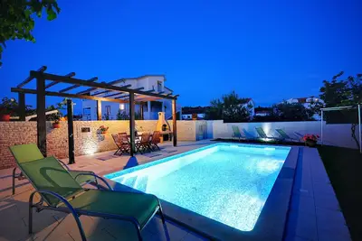 Image de Modern and spacious apartment with pool and garden, ideal for family vacations!