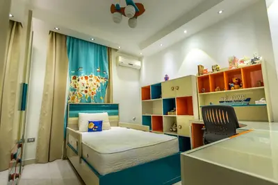 Image de A quiet family cozy place with gym equipments at new cairo