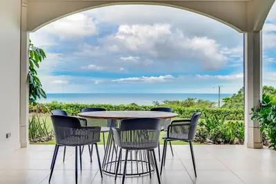 Stylish, ocean-view condo on ground floor with pool, washer/dryer, & patio
