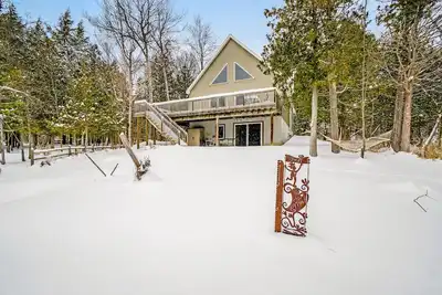 Dog-friendly riverside retreat with canoe, kayaks, paddle-board, and wood stove