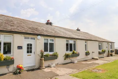 Image de South Cottage (Howick), pet friendly, with a garden in Craster